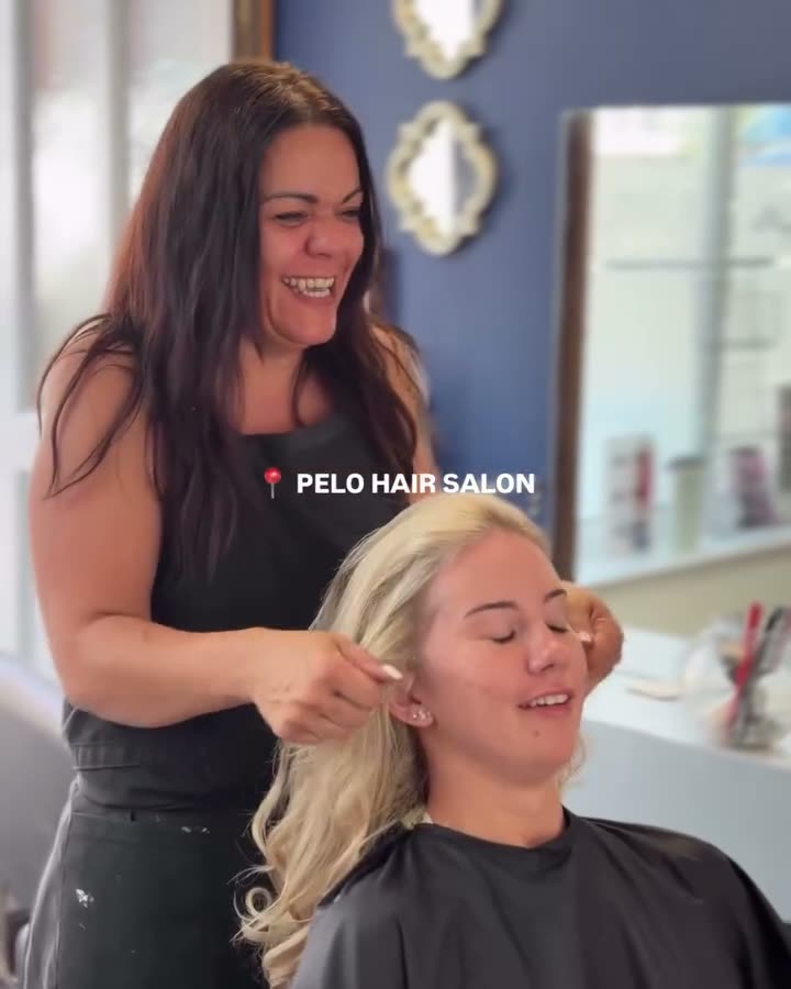 Sarah colouring a client's hair in the salon.