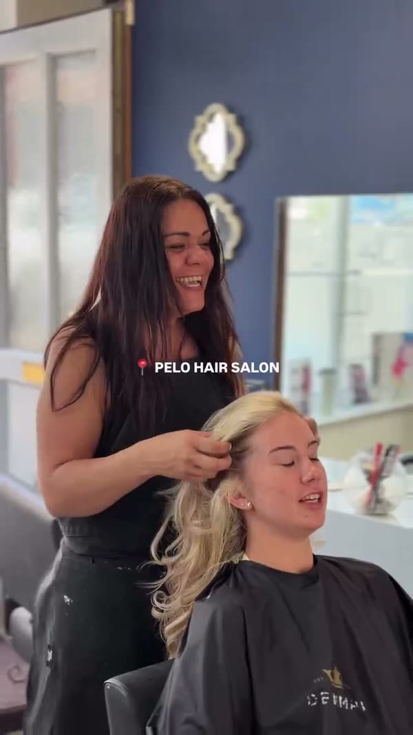 Sarah working on a client's colour in the salon.